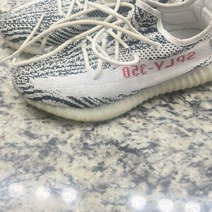 adidas mens Sneakers in White and Black with Red Accents